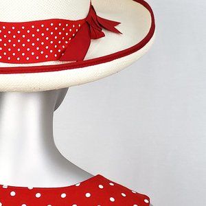 Straw hat with red and white polka dot trim